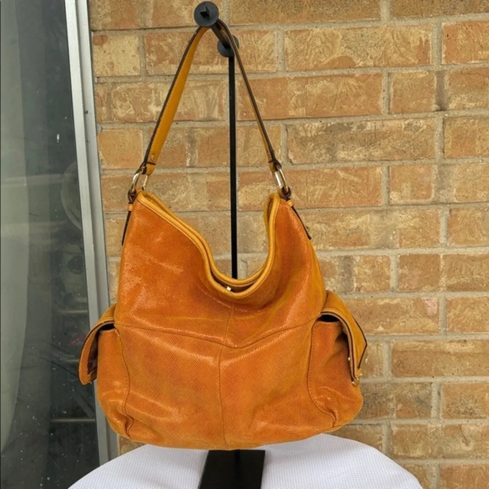 B. Makowsky Orange Hobo Bag